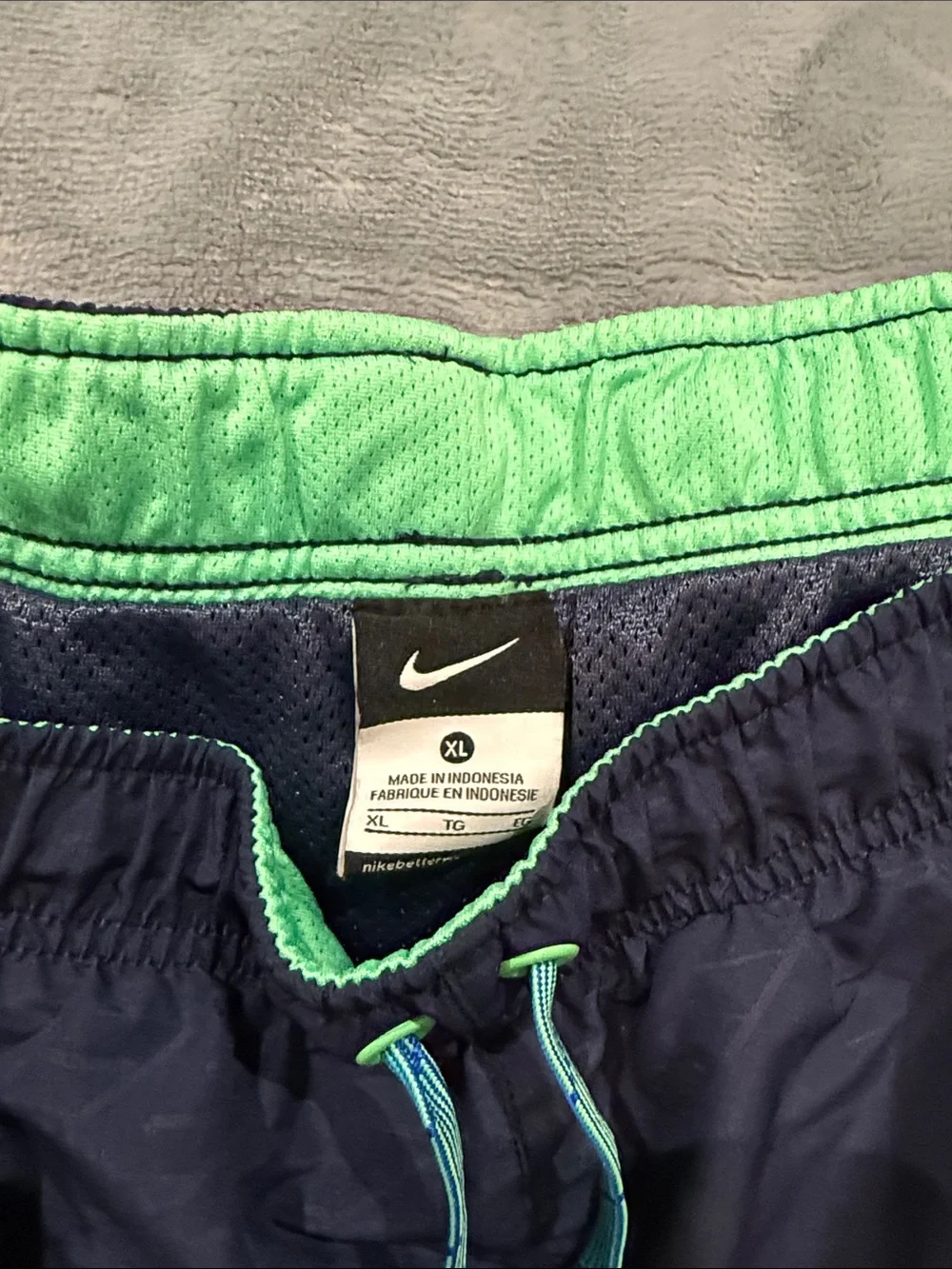 Nike Navy Athletic Shorts with Green Swoosh and Teal Drawcord